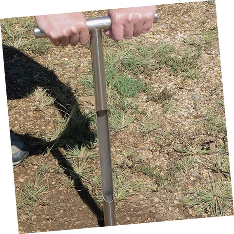 Hands using Stainless Steel Soil Sampler Probe With T Handle Contractor Grade Lightweight And Durable Tool on grassy ground