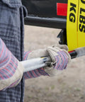 Worker using 36 Inch Chrome Winch Bar For Bolt On Or Weld Style Deep Storage Winches With Knurled Non Slip Handle on job site