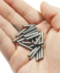 Hand holding 100 Pack 304 Stainless Steel Dowel Pins M3 X 18mm Shelf Support Pins for Bookshelves, Cabinets, and Closets