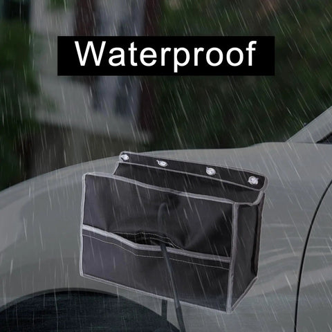 Tough As Nails EV Charger Port Cover 600D Oxford Cloth waterproof accessory in rain, protecting electric car charging port.