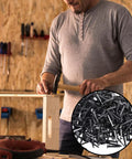 Man hammering wooden frame with 1000 Pack Half Inch Black Iron Shoe Nails Rust Resistant Boot Studs for sturdy furniture construction.