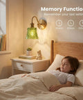 YUNICE Rechargeable Wall Sconces Set of 1 Battery Operated Wall Sconce with Remote Control Dimmable Green Glass Lampshade above bed.