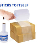 Person using Heavy Duty Pro Grade 60 Gauge Stretch Wrap Film 4 Inch By 1000 Foot Roll With Handle, wrapping boxes