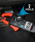 True RMS Digital Clamp Meter For DIY And Pros, 6000 Counts in use with wire, displaying 0.36 on backlit LCD