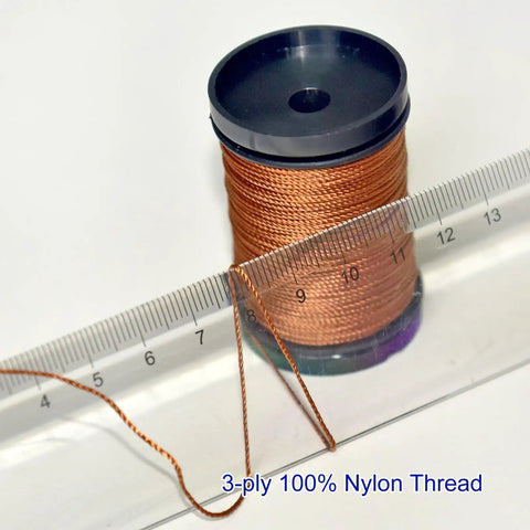Heavy Duty Upholstery Repair Kit With Extra Strong Sewing Thread And Hand Needles Includes 5 Nylon Thread Spools 7 Styles Leather And Canvas Needles And 1 Needle Threader For Carpets Furniture Coats Tents Mattresses And Leather DIY Projects - close-up of 3-ply nylon thread spool with ruler, for heavy fabrics.