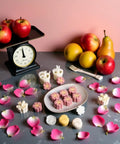 White Cherry Blossom Mooncake Mold With 30g Hand Press Cookie Stamp Six Petal Pastry Imprinter displayed with fruits and petals.