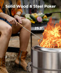 Smokeless 19 Inch Fire Pit For Camping With Waterfallflame Technology Triple Layer Combustion For Maximum Heat And Minimal Smoke Portable Outdoor Fire Pit With Steel Grill Rack, Fire Poker, Carry Bag, Easy Setup And Storage, Wood Burning in use with person tending fire.