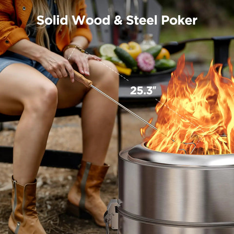 Smokeless 19 Inch Fire Pit For Camping With Waterfallflame Technology Triple Layer Combustion For Maximum Heat And Minimal Smoke Portable Outdoor Fire Pit With Steel Grill Rack, Fire Poker, Carry Bag, Easy Setup And Storage, Wood Burning in use with person tending fire.
