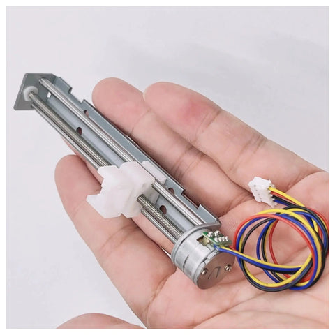 Person holding a DIY Friendly Two-Phase Four-Wire Stepper Motor Kit with 5V to 9V input, featuring 15mm drive, 80mm linear actuator.