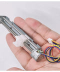 Hand holding Dc Stepper Motor Driver 5V To 9V 2 Phase 4 Wire with 80mm linear actuator for CNC machines and 3D printing projects