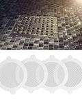 YUEHISY 50Pcs Shower Drain Hair Catcher Fiberglass Dense Mesh (50 Pieces) displayed on a tiled shower floor with a metal drain.