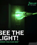 Green light illuminating a power outlet with a plug, showcasing power connection and visibility. Complete Sump Pump Setup With Tough One Half HP Motor And Smart 12 Volt DC Battery Backup Beats Rough Weather With Full Kit Check Valve Float Switch And PVC Pipes To Keep Basements Bone Dry While System Runs Smooth During Storms.