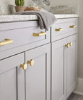 Champagne Bronze Cabinet Pull Blackrock Finish, 3 Inch Center To Center, Overall Length About 3.69 Inches, 1 Pack installed on gray cabinets