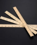Wooden Ruler Set 12 Pack Dual Scale 12 Inch And 30 Cm For Students And School Use Durable Hardwood With Smooth Finish displayed on black surface