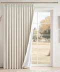 96 Inch Long Natural Pinch Pleated Blackout Curtains With Thermal Insulation And Linen Look One Panel 72W By 96L Inches Boss Level Light Blocking For Large Living Room Windows Track System Drapes For Bedroom Privacy And Noise Reduction in a living room window.