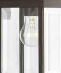 Close-up of Gibbes Street Collection 1 Light Outdoor Wall Lantern in Antique Bronze with clear beveled glass.