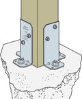 RPBZ ZMAX Galvanized Retrofit Post Base For Double 2x4 Posts Pack Of 12 attached to concrete with bolts for outdoor structures.
