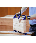 Six Inch Mini Bar Clamp Two Pack With One Hand Quick Release Trigger holding wood pieces firmly during woodworking project.