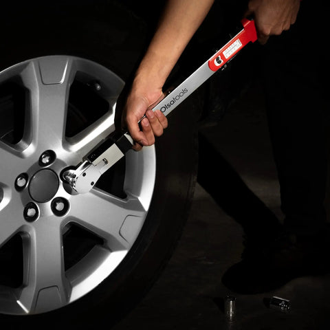 Flex Head Split Beam Torque Wrench With Easy Knob Dial used on car wheel for precise tightening and accurate torque control.