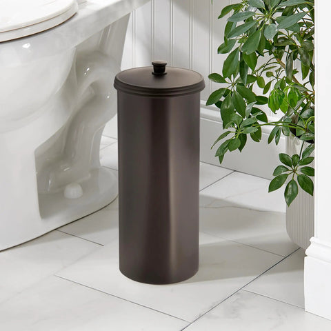 Freestanding Bronze Toilet Paper Holder With Lid For Three Extra Rolls next to toilet in a modern bathroom setting