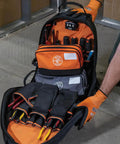 Dual Compartment Tool Pouch Heavy Duty Tool Bag Organizer showing organized tools in orange and gray fabric compartments
