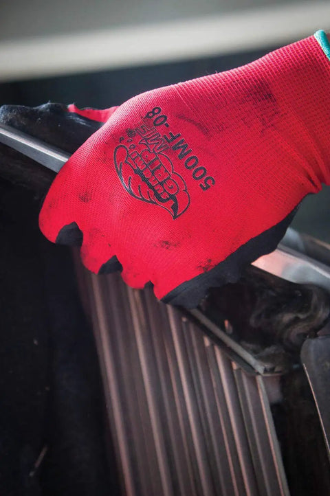 Close-up of red Tsunami Grip Mach Finish Nitrile Coated Gloves With Double Dipped Micro Finish for abrasion resistance and oil grip.
