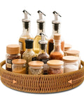 Go To 12 Inch Rattan Lazy Susan Organizer Rotating Serving Tray With Handles for Kitchen Counter displayed with spices and oils