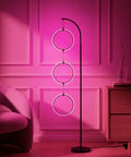 Dope RGB Color Changing Floor Lamp With Arching Three-Ring Pendant in vibrant pink in living room, modern three-ring design, sleek finish