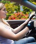 Woman driving with All Day Comfort Wrist Wrap For Carpal Tunnel And Arthritis Relief, Adjustable Fitted Brace That Fits Both Hands, One Size.