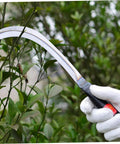 Two Piece Multi Function Mowing Tool Rustproof Scythe For Weeding Harvesting Gardening With Comfortable Grip in use on plants