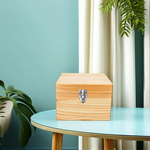 Wooden box with Twelve Pcs Retro Metal Box Latch Hasps With Screws For Jewelry Boxes, secure on a blue table.
