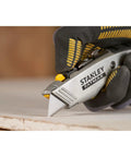 Close-up of hand using 2 In 1 Snap Off Knife Xtreme With Stainless Steel Blade Guide 9mm Width Quick Blade Change Via Notched Wheel