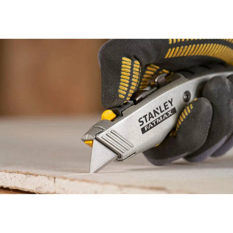 Close-up of hand using 2 In 1 Snap Off Knife Xtreme With Stainless Steel Blade Guide 9mm Width Quick Blade Change Via Notched Wheel