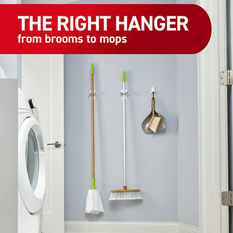 Damage Free Broom And Mop Holder Wall Mount With Adhesive Strips, Holds Up To 4 Lb, Includes 2 Hangers And 4 Strips installed in laundry room
