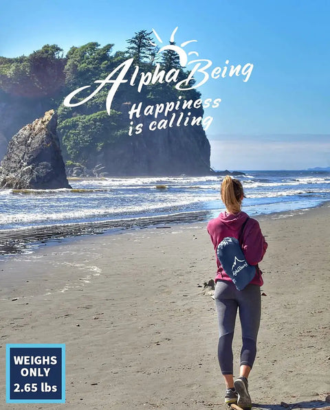 Woman walking along the beach carrying Inflatable Lounger Beach Chair With Air Sofa Hammock For Camping And Backyard Hangout Ready Quick Inflate No Pump Needed Portable Couch By Lakeside Includes Compression Sack Durable Outdoor Gift For Adults.