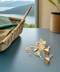 Stainless steel fishing bite alarms with clips on a table, ideal for freshwater and saltwater use, enhancing early bite detection.