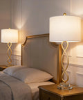 Dope Gold 30 Inch Table Lamps Set of 2 on bedside tables, white fabric shades, crystal bases, creating ambient lighting.