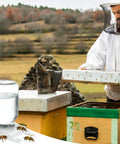 Beekeeping Water Dispenser Lids For Mason Jars, beekeeper using hive equipment next to metal entrance feeders and bees