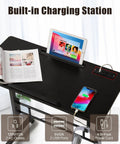 Total Game Changer Small Height Adjustable Standing Desk With Tiltable Tabletop And Smooth Rolling Wheels customized with built-in charging station.
