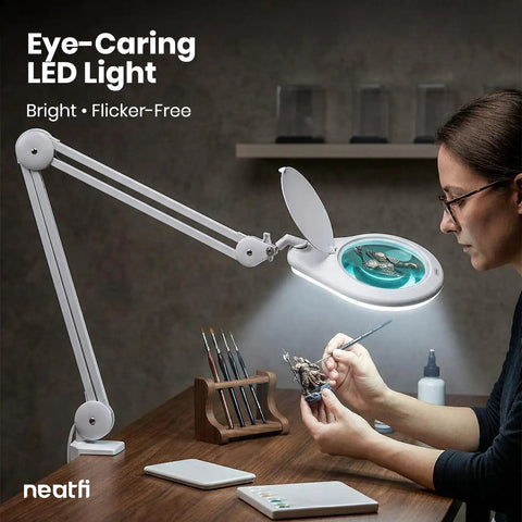 Person using clamp on magnifying lamp with 7 inch glass lens 5 diopter 6500K daylight LED glare free adjustable arm for crafting
