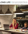 Modern kitchen with A19 LED Bulbs 60W Equivalent, 800 Lumen Natural White 3500K lighting above a woman and child at table.