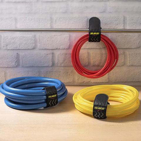 Elastic Cinch Straps With Anti Slip Strips 12 Inch Long 2 Inch Wide Eight Pack on coiled red, blue, and yellow hoses