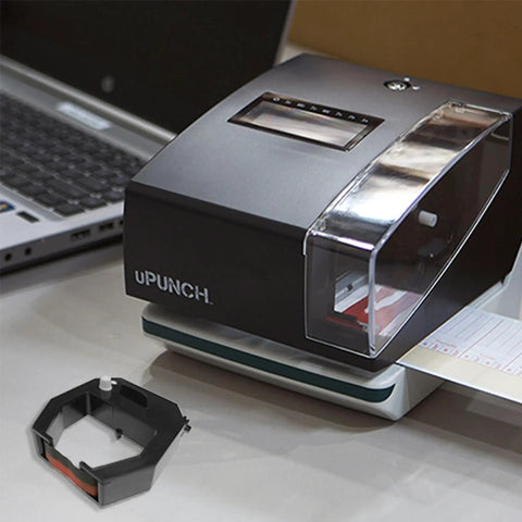 Top Tier Cr1000 Replacement Ribbon Cartridge For One Time Clock And Date Stamp Machine next to a manual time clock on a desk.