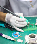Hands using Soldering Pen And Solder Wick Kit For Electronics Repair With No Clean Pens and Braided Wick on circuit board