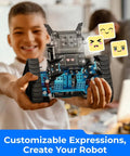 mBot2 Rover STEM Coding Robot Kit For AI Learning, Aluminum Robot With Sensors For Easy To Advanced Projects, Control With Smartphone Or Gamepad Or Auto-Program, Bluetooth And Wifi Enabled, Learn Block-Based To Python Coding, Perfect For Classrooms And child holding blue aluminum robot