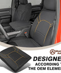 Interior view of Dodge Ram truck showcasing center console with vegan leather armrest cover; designed for 2019-2026 bucket seats.