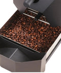 Image of roasted coffee beans in a Real Deal High Efficiency Automatic Electric Coffee Bean Roaster Machine Featuring Nine Professional Baking Curves And Integrated Smoke Filter For Smoother Home Brewing Vibes.