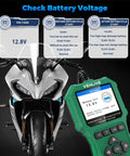 Motorcycle with VEHLIVE's V880 Upgraded 2025 Motorcycle Diagnostic Tool showing battery voltage for Yamaha Honda Kawasaki BMW.