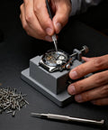 Watchmaker using 100 Piece Watch Battery Clamp Screws Set For Tiny Small Screws, Pro Grade Repair Kit Tools