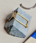 Wilson Brass Keyring With 2 Inch Carabiner Clip resting on stone surface, showcasing minimalist design and durable construction.